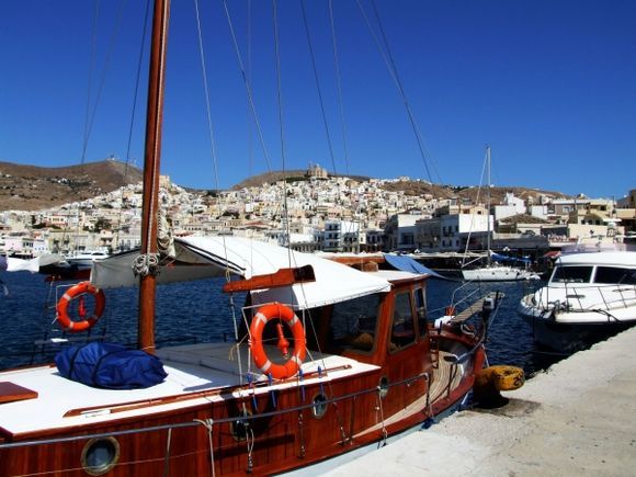 A view from the port of ermoupolis to syros island - to the background the two hills of the town of ermoupolis with the two churches to the peaks, one orthodox and one catholic
