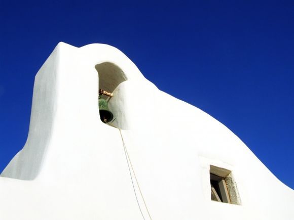 A classical type of church from cyclades islands - At Paros island, i saw this simple shape small church, making contrast with the blue sky