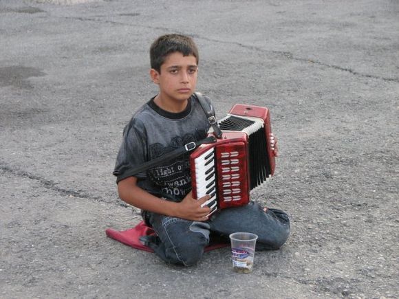 Music and dance are directly woven into the Cretan psyche and their social-life, from the earliest days to the very present.

This lovey boy was playing in the old part of charming Chania.