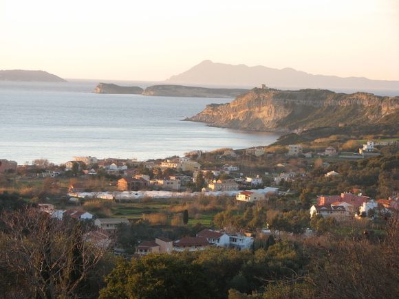 A winter visit. A view over Arillas, with the sun going down behind the Diapontian Islands.