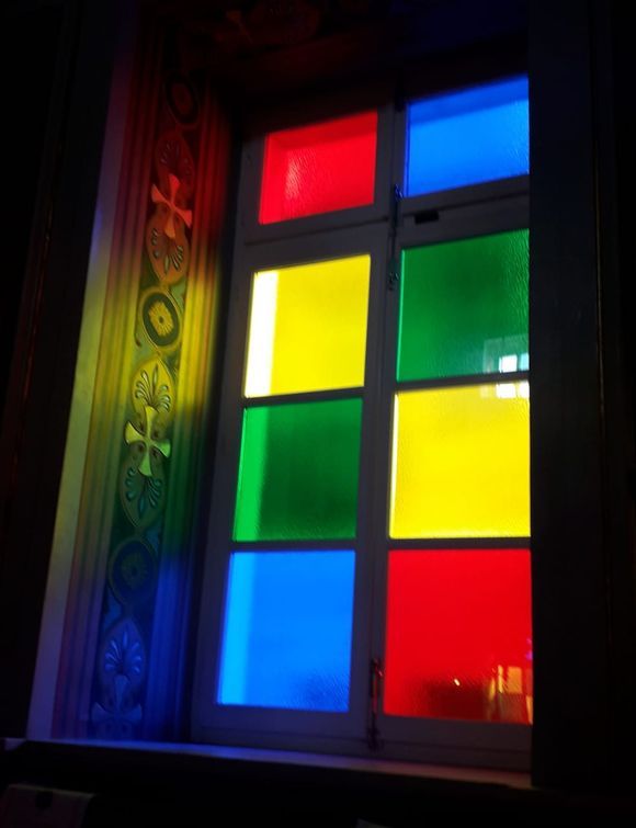 The colourful window panes.