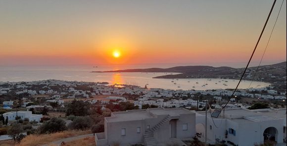 Sunset over the heart-shaped Paros bay.