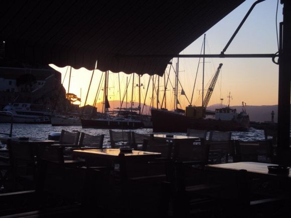 Sunset and sailboats of Hydra Greece