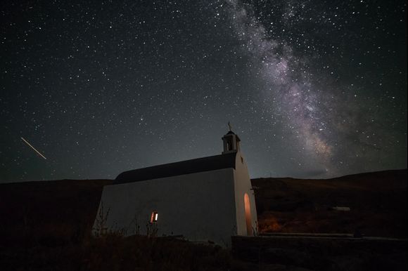 Orthodox church under a blanket of stars above Platys Gialos beach in Serifos. I passed by in the morning on my way to the beach and was sure there would be a blanket of stars at night. Photo made by me