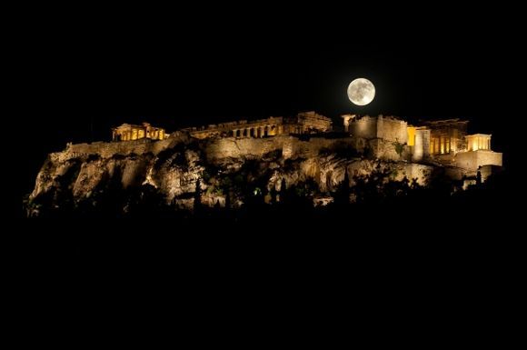 Acropolis of Athens, Greece with Supermoon at night.