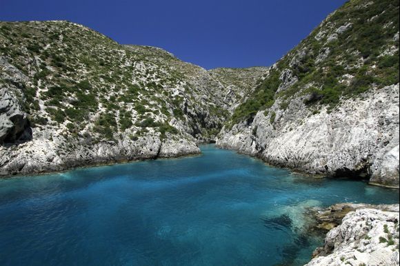 Blue waters and green landscape at Porto Vromi, Zakynthos!