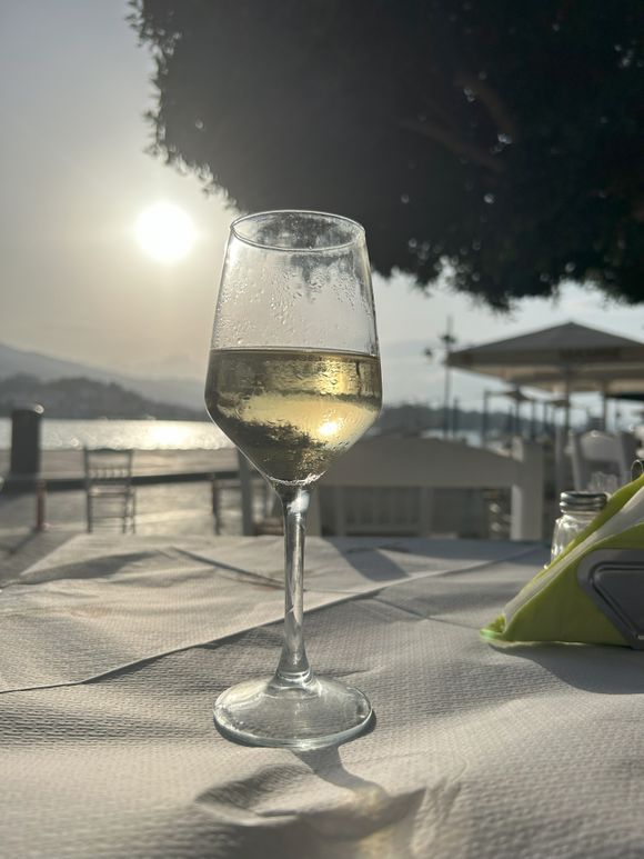 A delicious glas of wine and waiting for the sunset
