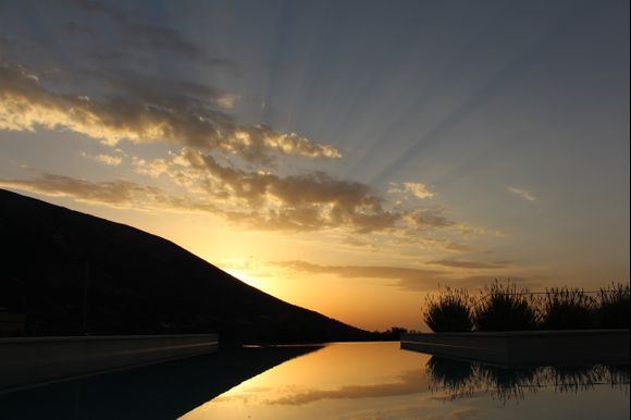 Sunrise in Pylaros, across the pool