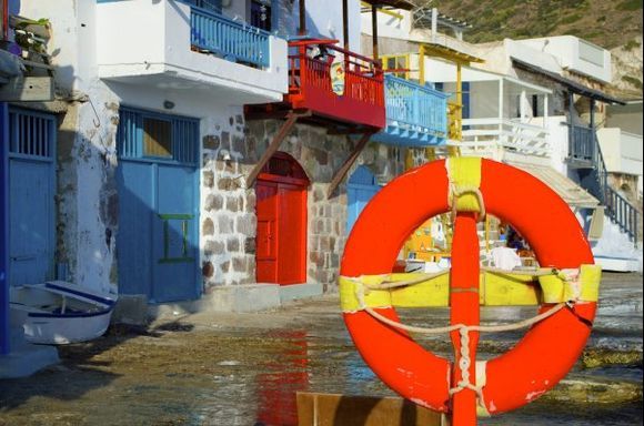 Syrmata (boat garages) painted in blue, red, yellow