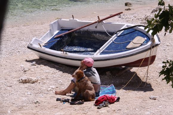 A young girl and the dog; ready for sea..