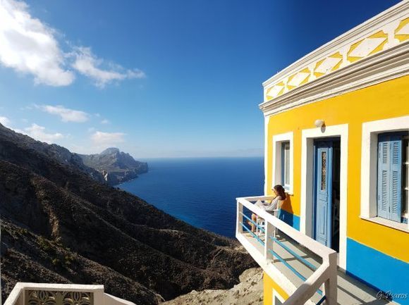 Traditional house on the edge of Olympos village in Karpathos island, beautiful colors, flying feeling.