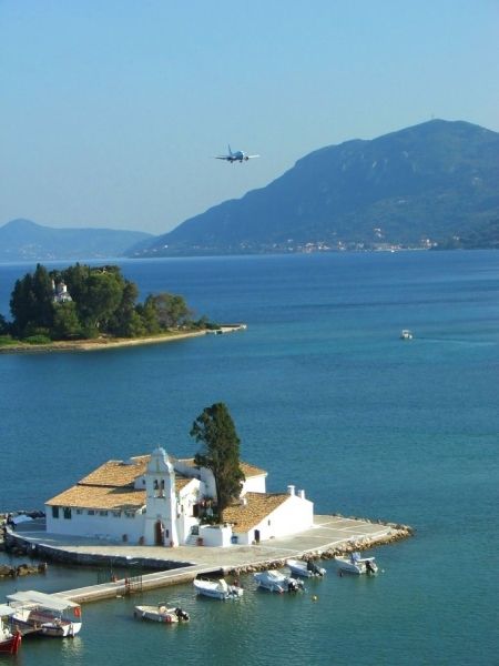 Airlane landing, Pontikonisi island and Vlacheraina monastery seen from the hilltops of Kanoni, Corfu