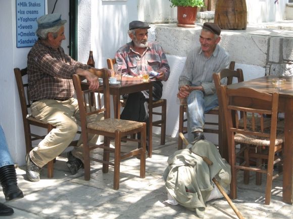 Greek men relaxing in ckafeneion in Aparanthus