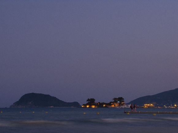 aghios sostis and marathonisi island at dusk