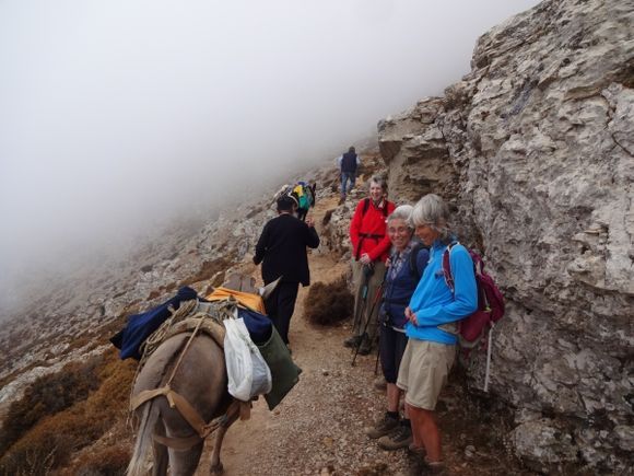 Amorgos Island Sept 2016. Precipitous path to Stavros church on feast day with priest & donkey carrying supplies.