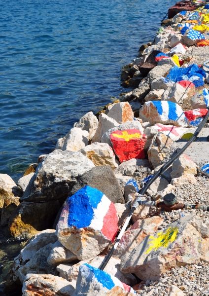 Painted rocks in Poros harbour.