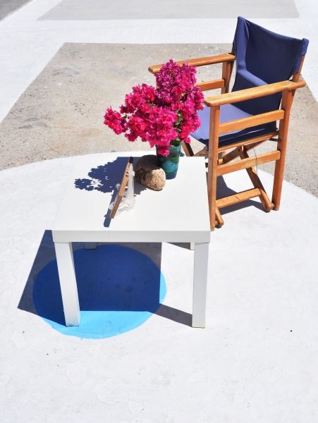 Just a chair, a table and flowers.