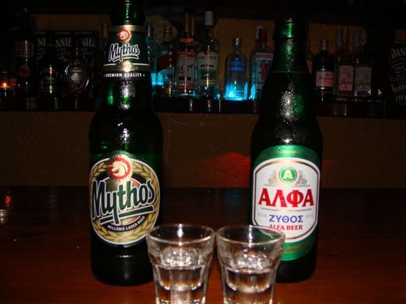 Having Greek beers and Raki, an authentic Greek shot, at a fun bar in Fira.