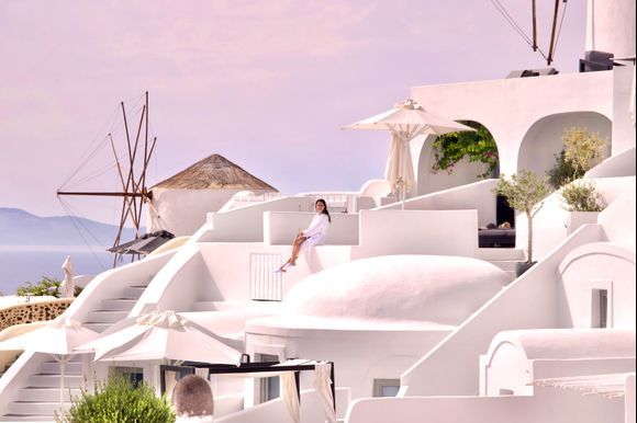 Lady in white with her champagne...Oia,Santorini