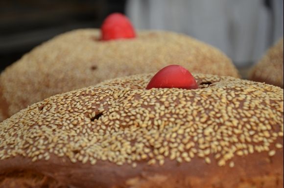 No, it's not the beach, they are 
painted eggs in loaves to celebrate Easter