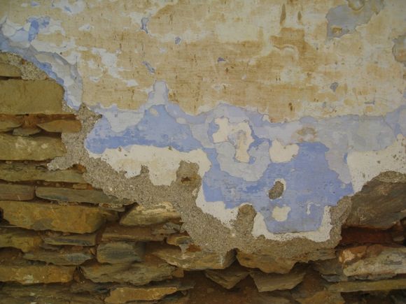Layers of paint on the wall of a derelict house in Skopelos town.