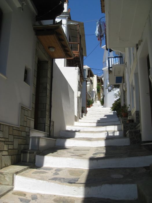 One of the long sets of stairs up through Skopelos Town.  It starts near Anna\'s Restaurant.