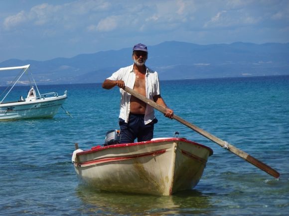 Fisherman returning on Hanioti beach