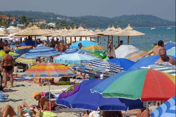 Colourful umbrellas on Polychrono beach on the Kassandra peninsular
