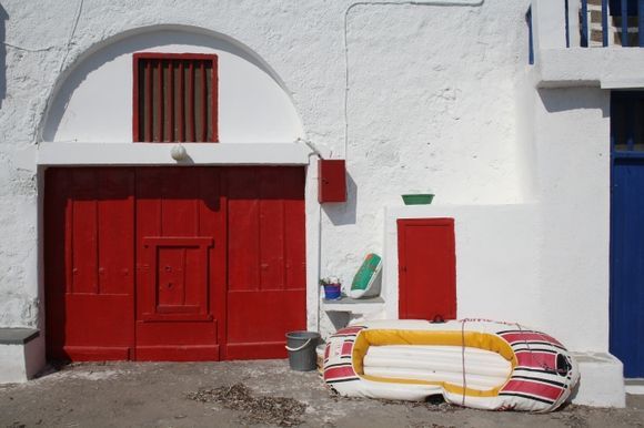 Red boathouse in Milos