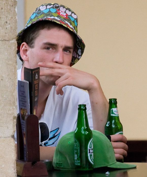 Portrait with two hats and two beers