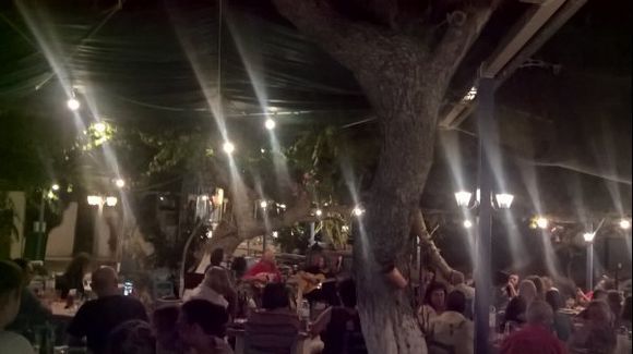 Agio Marinas night at open restaurant trees and sea view...