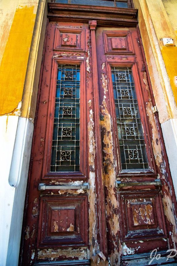 Old textured door in Plaka. Still beautiful