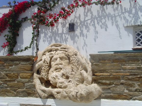 sculpture of Dyonisos\' head in Tinos, Pyrgos