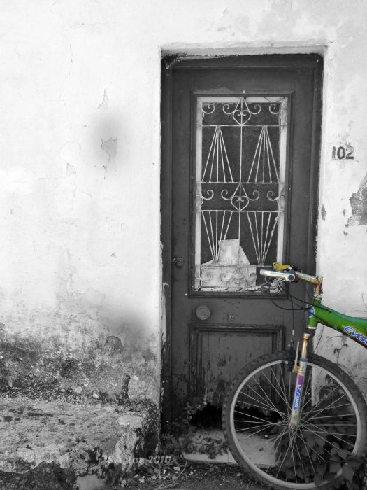 Rusty Bike Against Door...