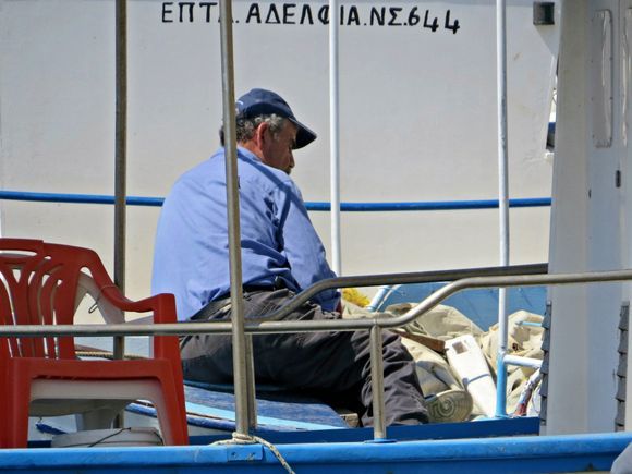 06-09-2018 Ikaria: Karkinagri ..... Fisher was falling a sleep on his boat ....