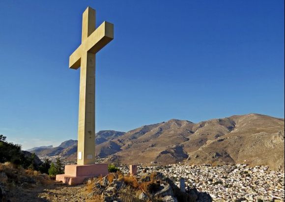 20-09-2014  Kalymnos: The enormous cross nearby the Monastery Agios Savvas with view on Pothia