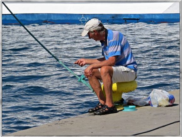 17-09-2014  Leros:  Fishing at the harbour