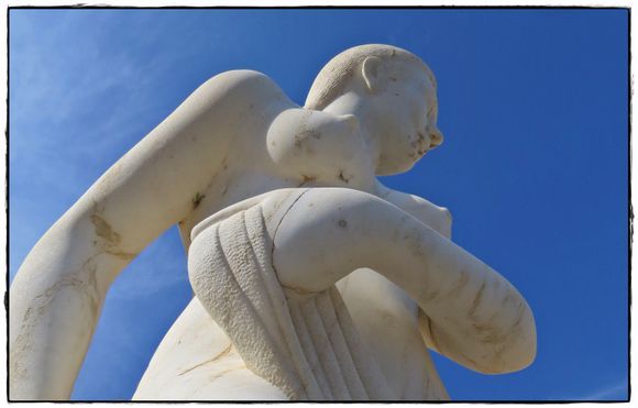 20-09-2019 Ikaria: Therma .........A piece of a statue against blue sky