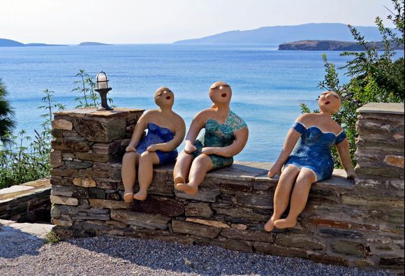 28-08-2022 Andros: Batsi ........Three ladies on a wall enjoying the sun