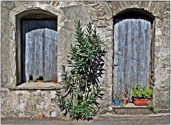 18-09-2019 Ikaria:  Old door and old window in a small village on Ikaria