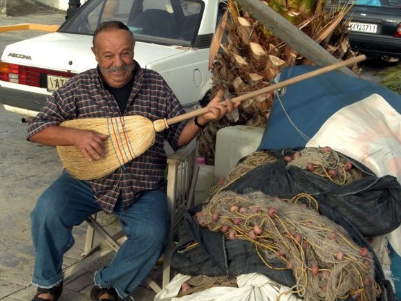 fisherman in Ermioni with modern bouzouki and many strings