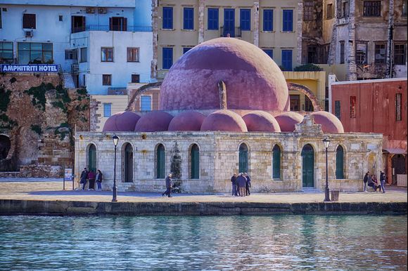 Chania harbor's historic Turkish mosque of the Janissaries, built in 1645 and the oldest Ottoman building in Crete serves as a favorite meeting spot.