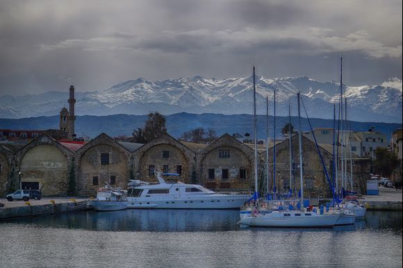 The White Mountains (Lefka Ori) serves a backdrop for this Chania harbor scene.