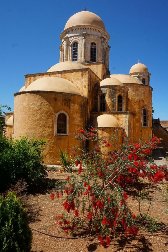 Domes and spring flowers dominate throughout the grounds of the Agia Triada of Tzagarolon monastery.