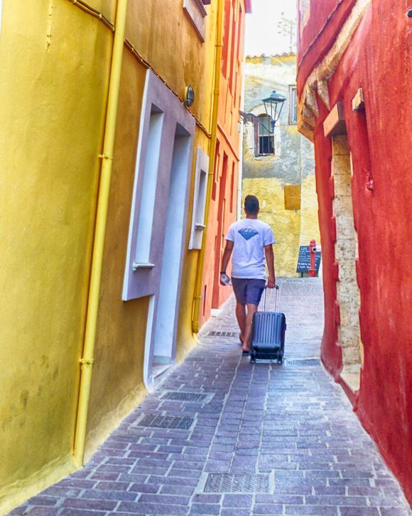 A visitor navigating the narrow streets of Chania's Old Town.