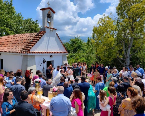 A big Sunday wedding/baptism at the little Agia Kiriaki village church in Vryses. You should never judge the size of a Greek wedding by the size of the church :-) ...hundreds of people were in attendance for this beautiful event.