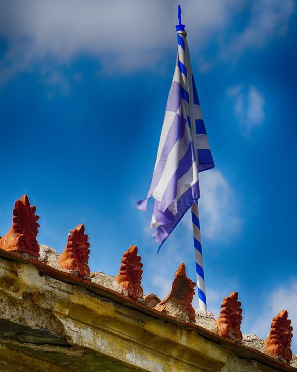 The weathered edge of a Plaka rooftop.