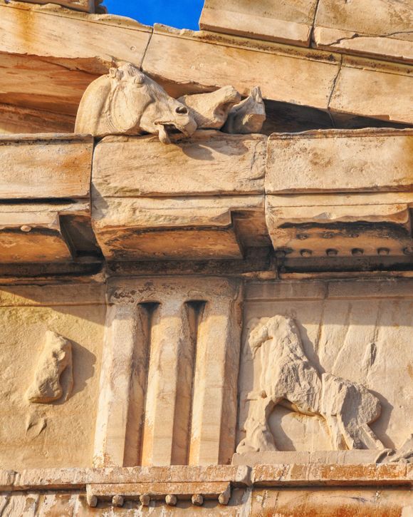 Horse statue and relief artwork on the Parthenon's east pediment.