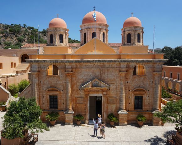 Visitors take in the exterior of the monastery church before entering. 