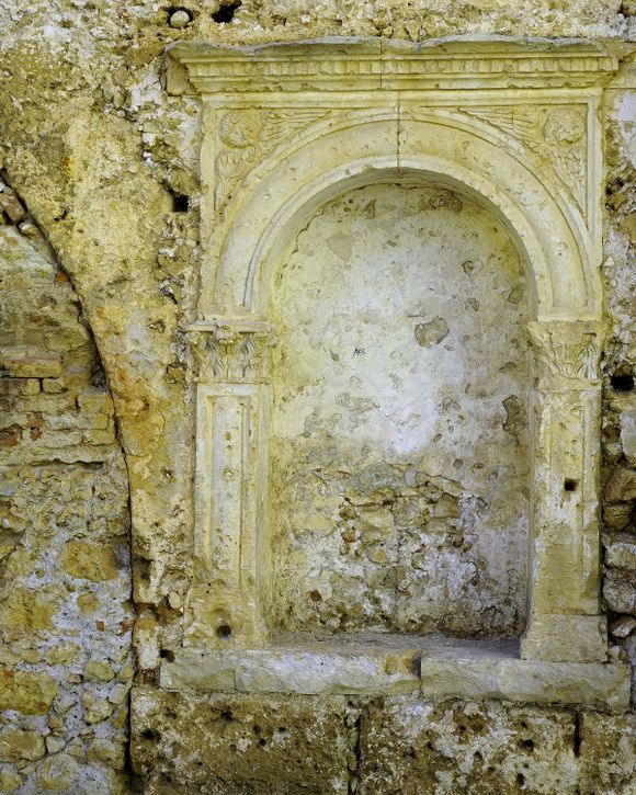 An ornately carved niche on the southwest corner of the Venetian neoria in Chania's old harbor.